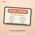 Placeholder mockup (not a final Printify product photo): printed dog feeding mat with a retro FUEL STOP sign, the line OPEN 24 HOURS, SNACKS ARE A RIGHT, two bowl circles labeled KIBBLE and WATER, and a checkered strip along the bottom